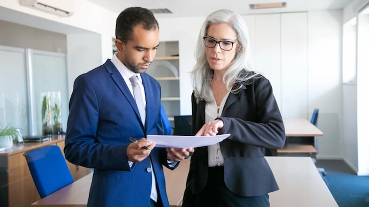 Qualifying free zone person conditions — scales of justice and compliance icons