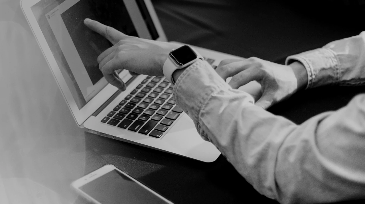 Business adviser reviewing information on a laptop.